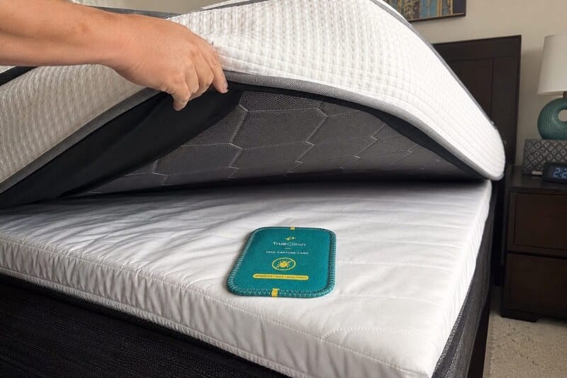 Customer review photo with CaptureCards near a mattress