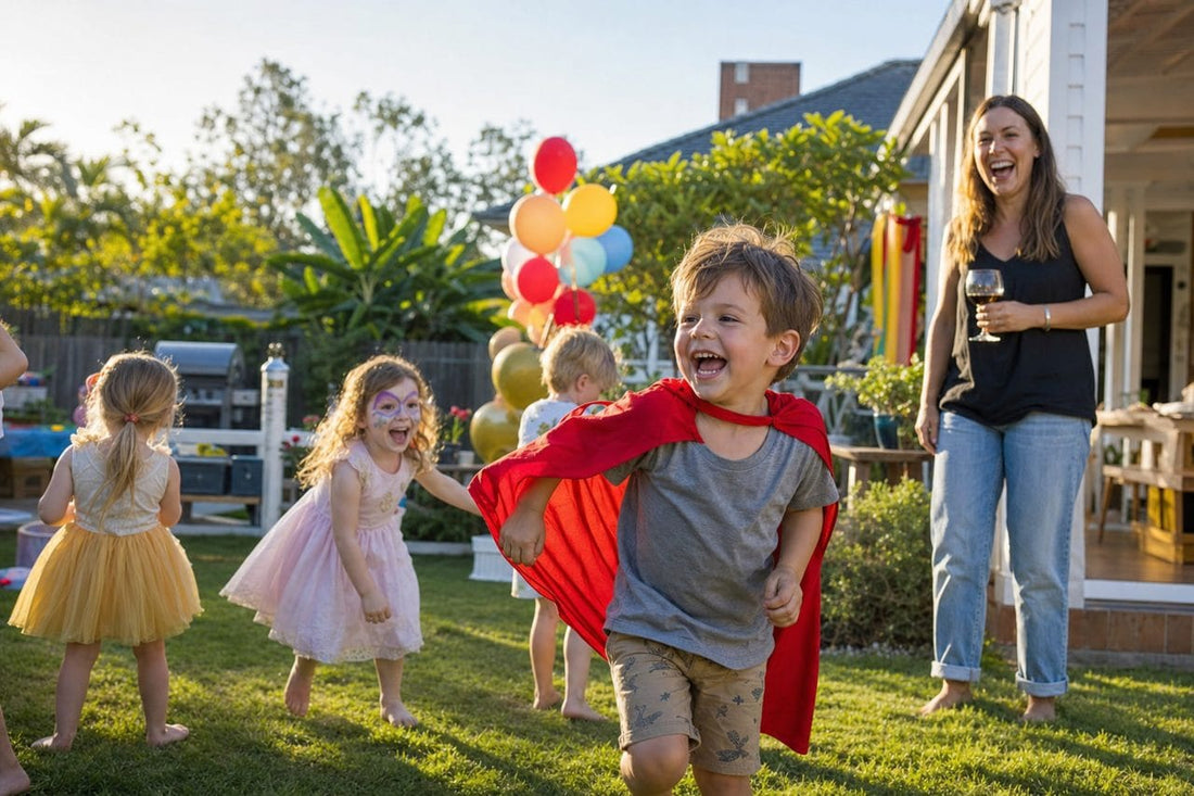 Little boy in a cape running at his birthday party