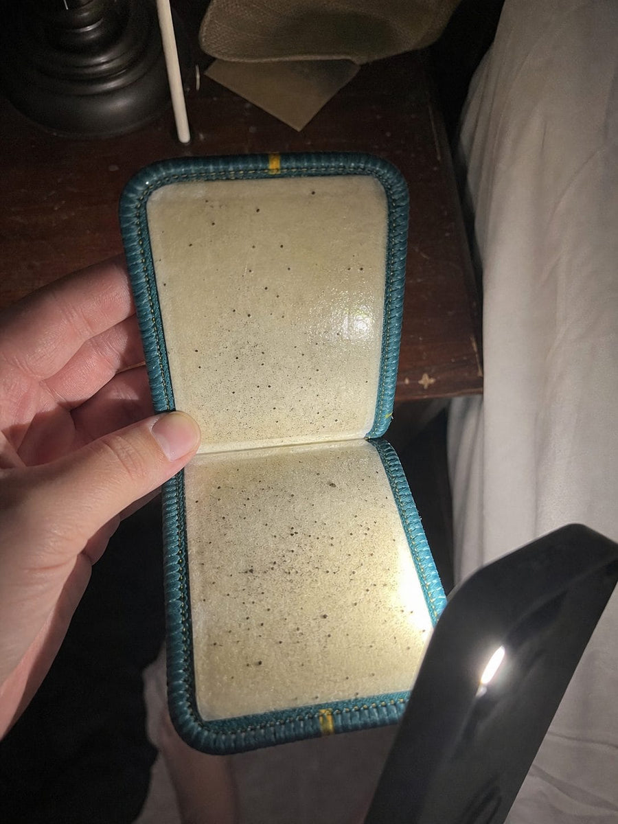Opened CaptureCard showing trapped black dots inside