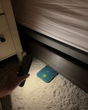Customer checking CaptureCards with phone light