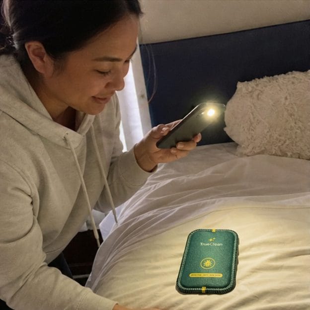 Customer checking CaptureCard with phone light
