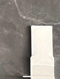 The clip as it arrives: a flat strip
